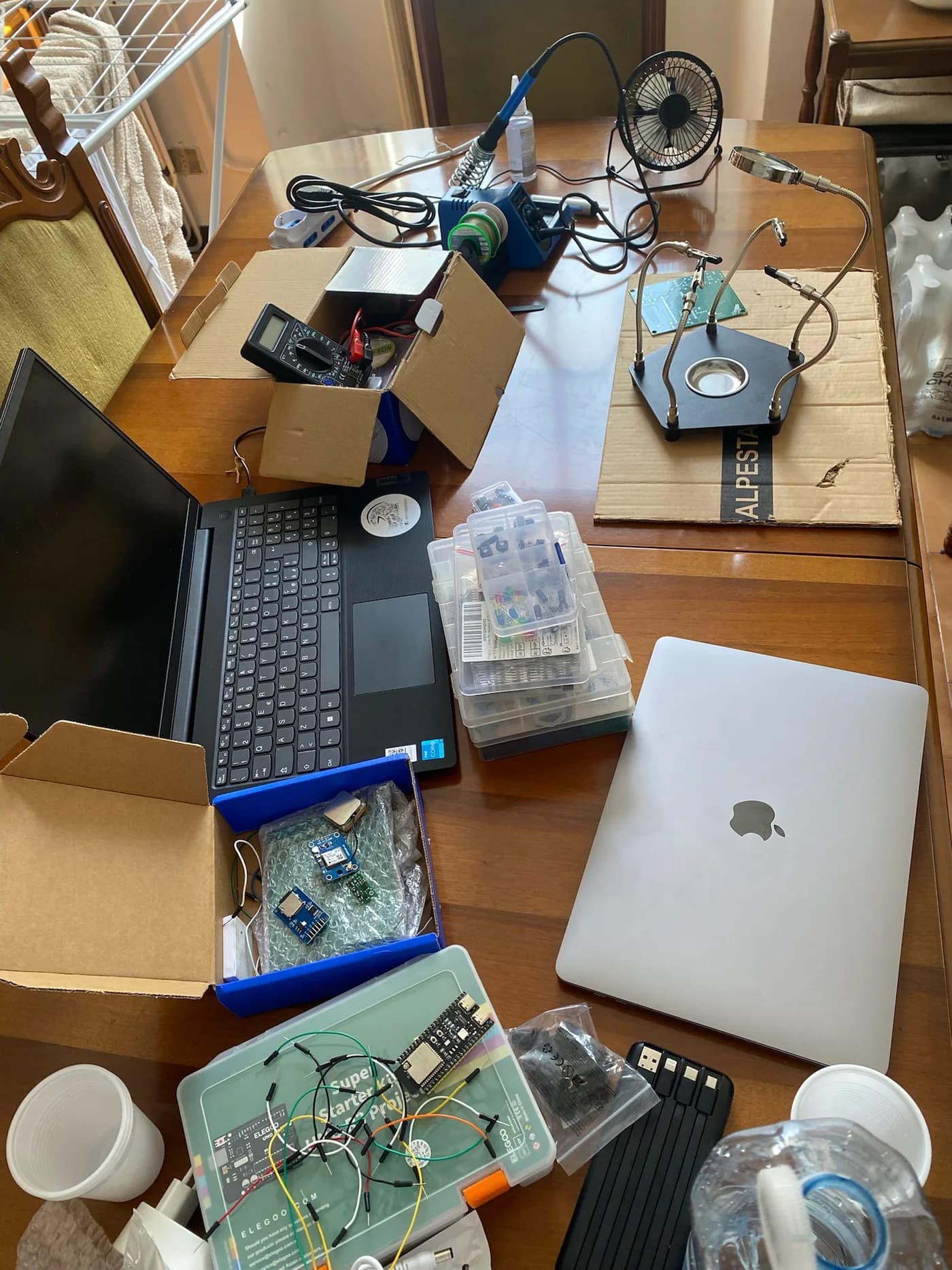 The workbench: laptops, wiring and electronics.